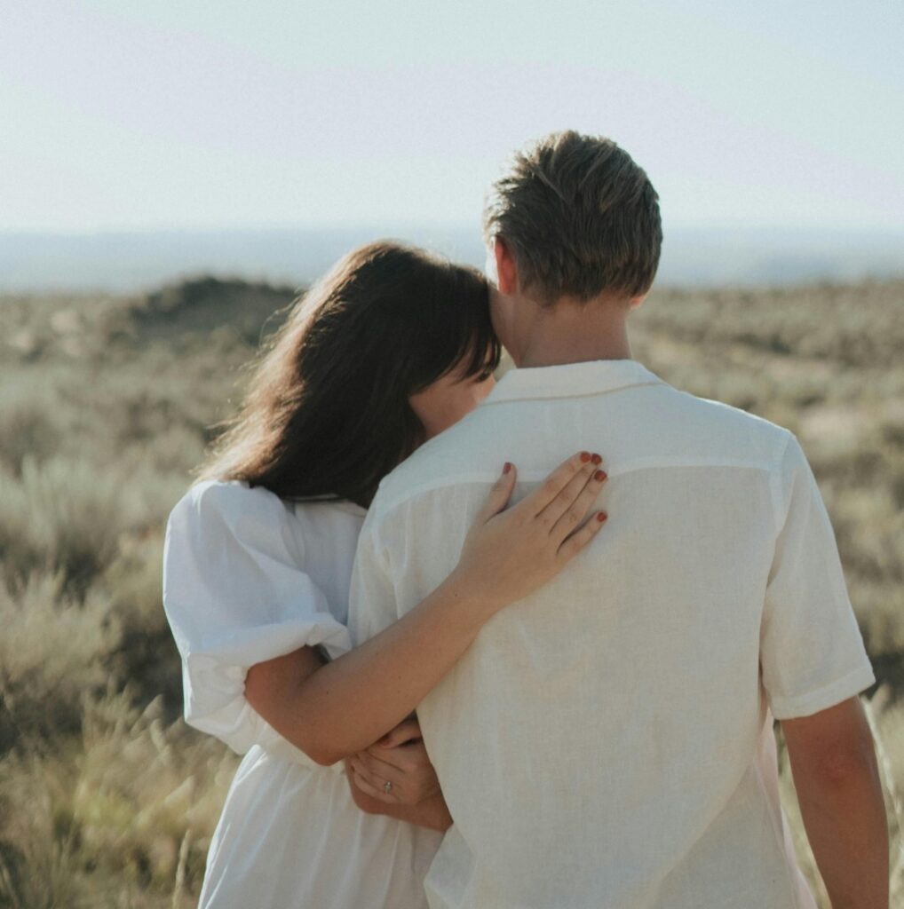 Couple Hug outdoors thankful for Critical Illness Payout