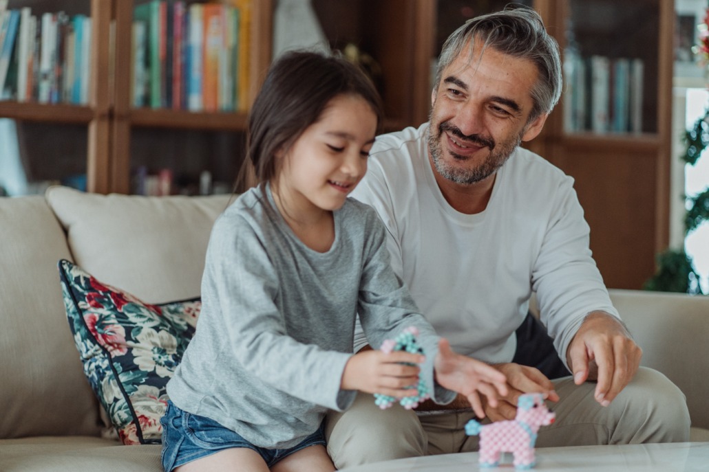 Dad watches Daughter play and is happy he has critical illness cover
