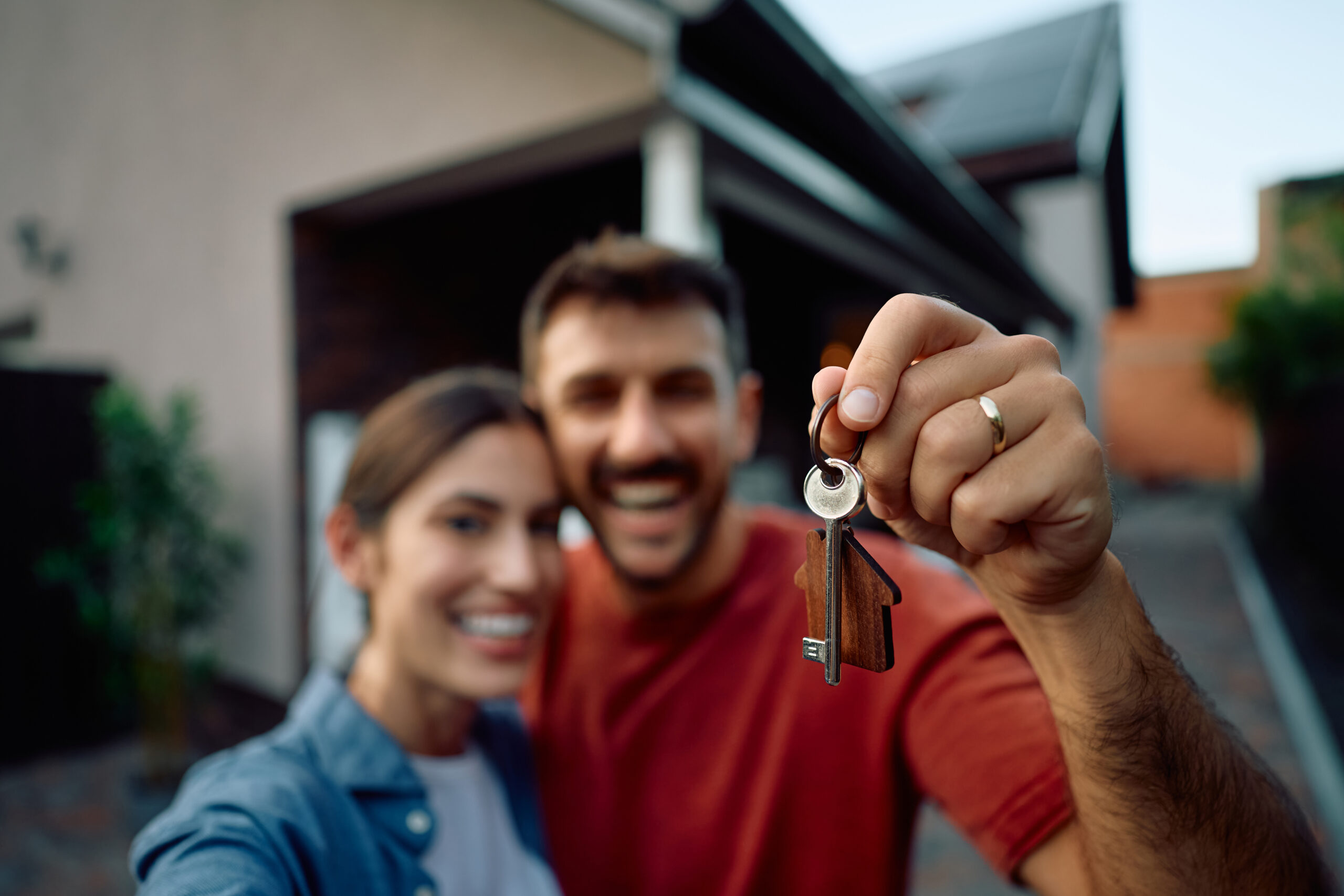 Close up of new homeowners holding house keys